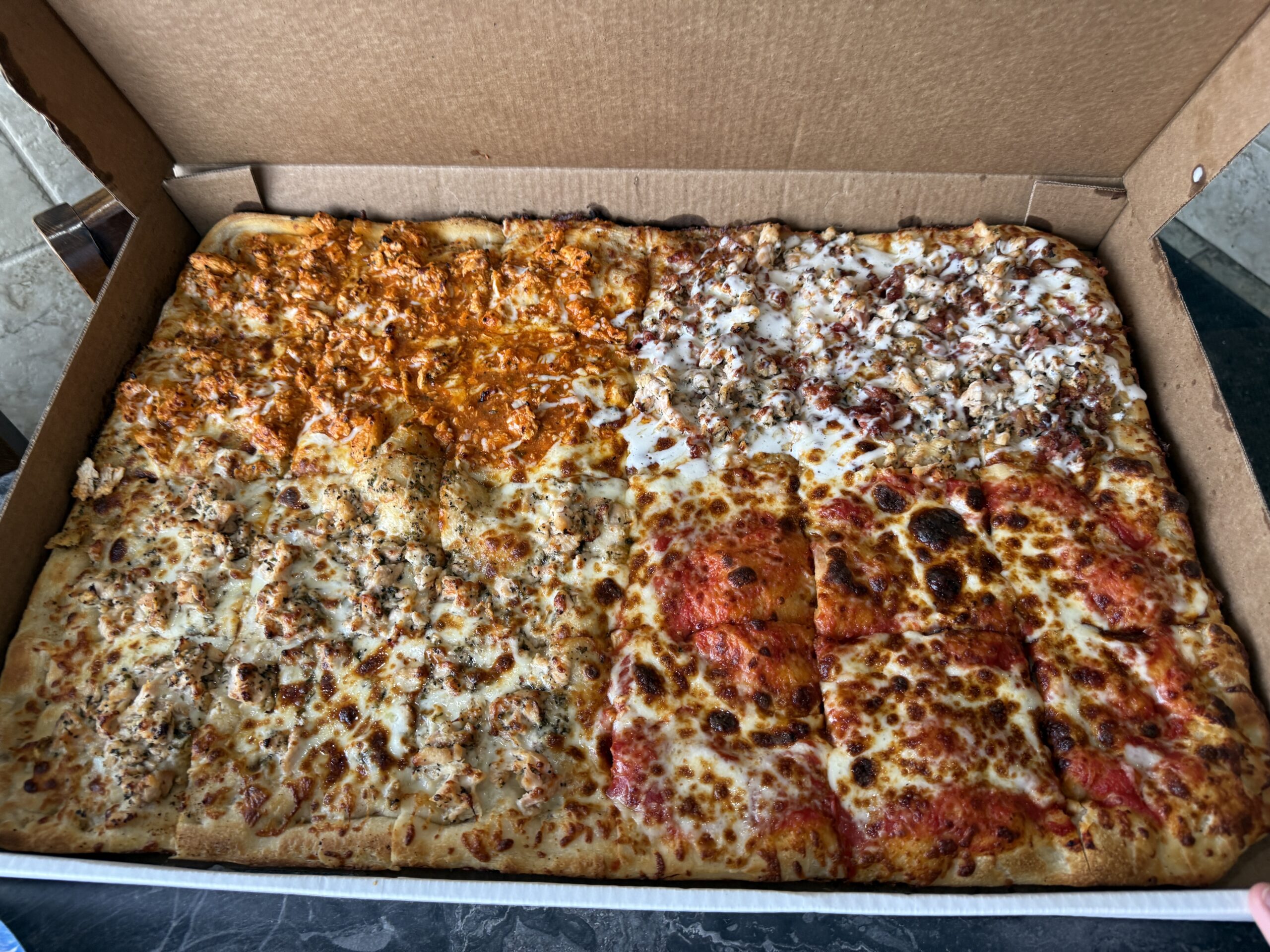 Nirchi's Full Sheet Pizza made into 4 separate quarter sheet pizzas with different toppings!