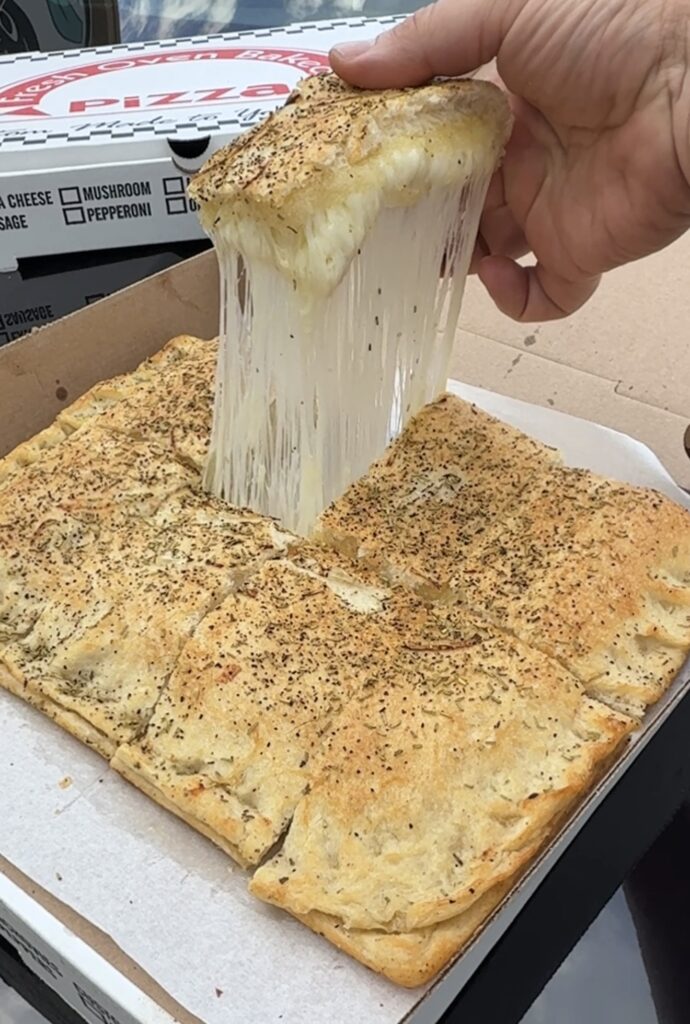 Ghigiarelli's Old Forge Pizza Cheese pull white pizza